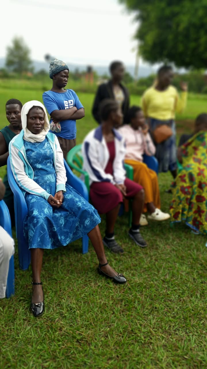 Facilitator addressing young men at a community session