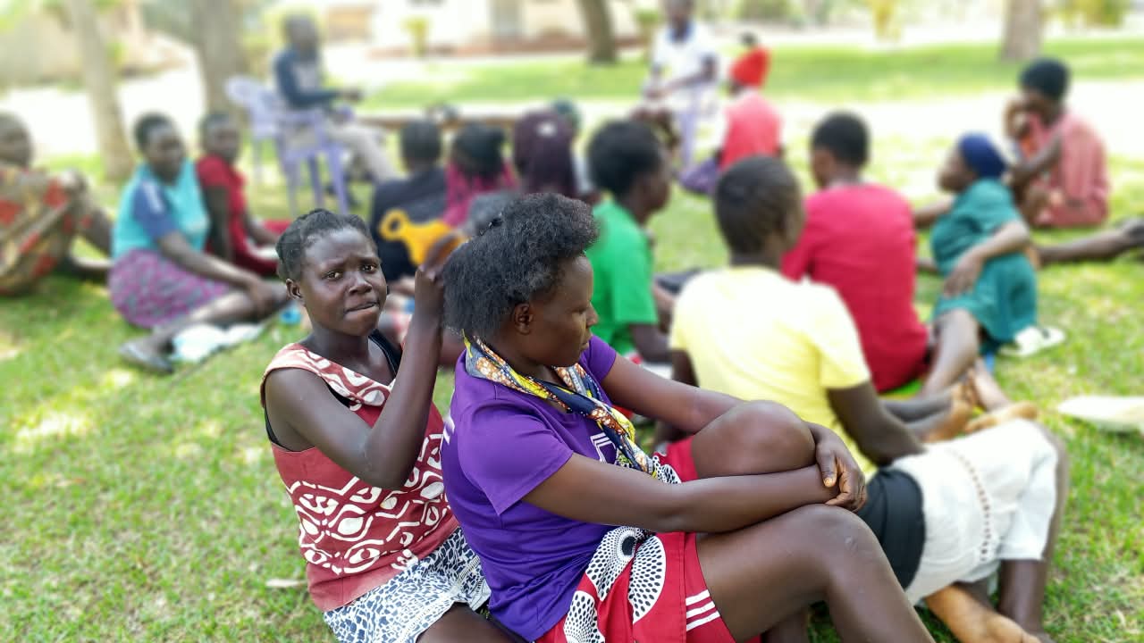 Young parents gathered at an outdoor community session